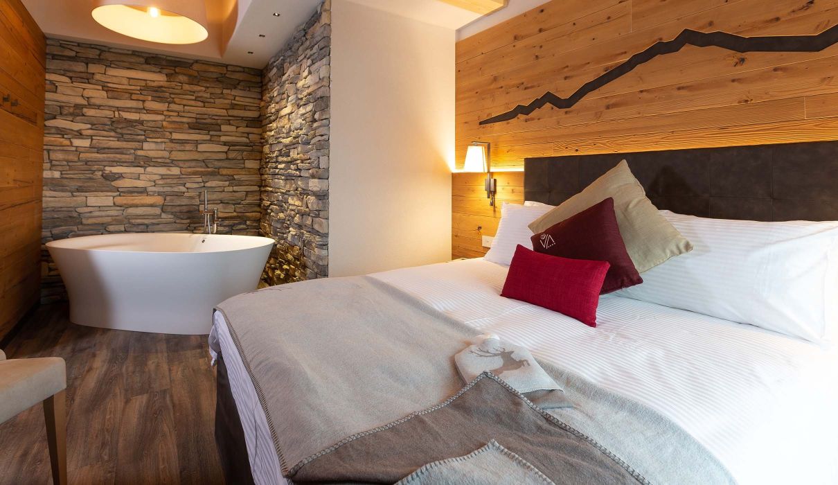 Custom-made furnishings for luxury mountain hotels: suites with in-suite bathtubs