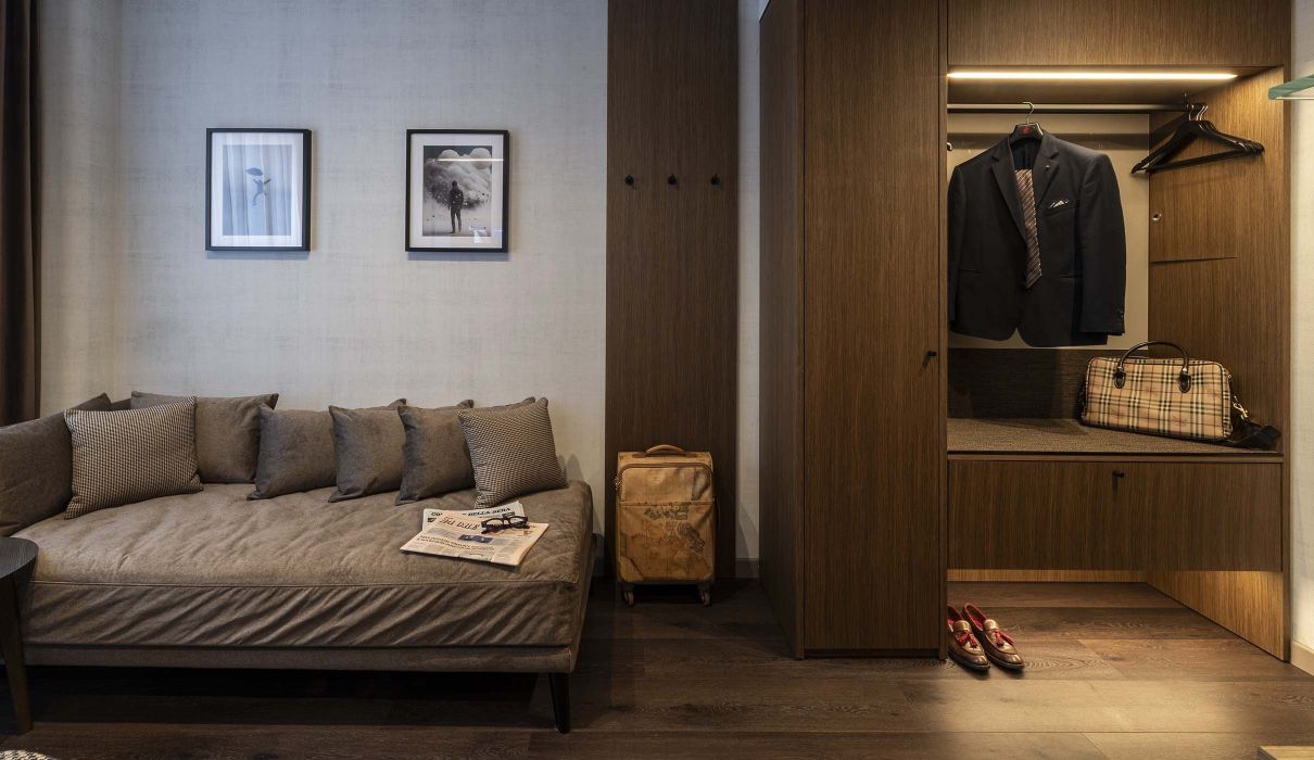Custom made hotel room furniture with wardrobe area and sofa