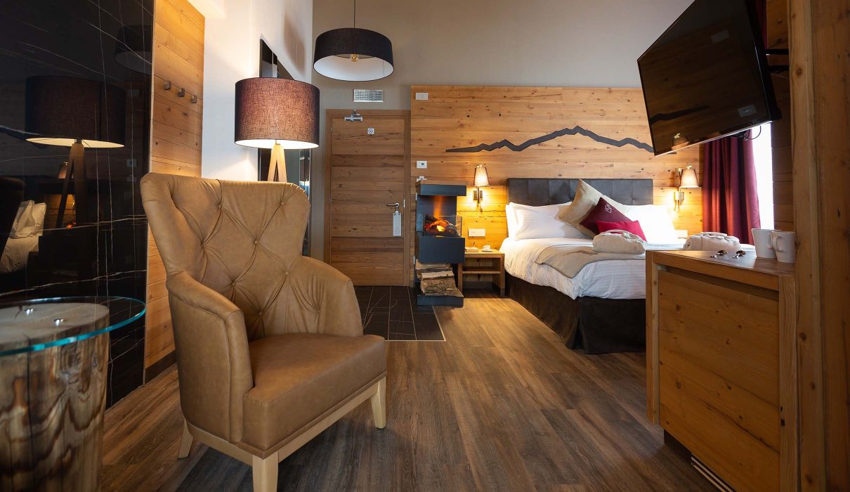 Custom-made furnishings for luxury mountain hotels: suites with in-suite saunas