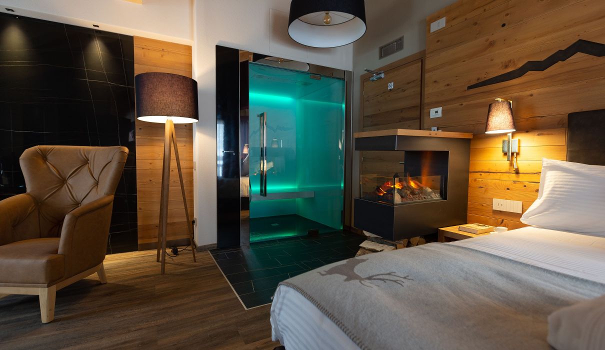 Custom-made furnishings for luxury mountain hotels: suites with in-suite saunas
