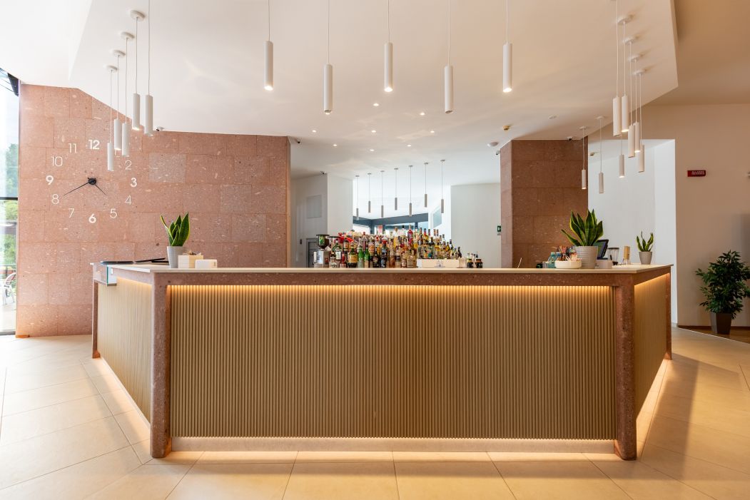 Custom-made hotel furnishings in an elegant modern style: bar counter