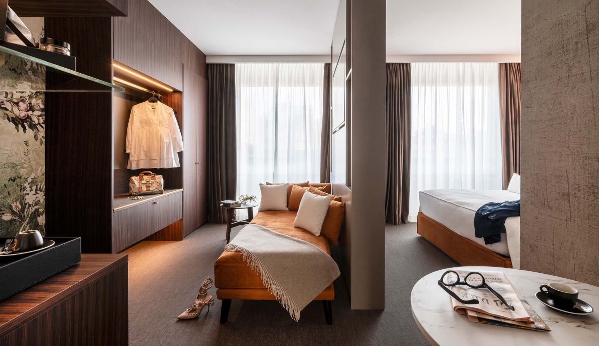 Custom Hotel Furnishings: Suites with Upholstered Headboard and Sitting Area