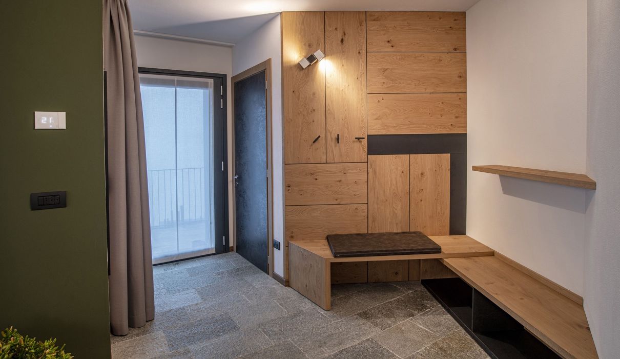 Ca' Rossa Suite & Breakfast**** Arredamento su misura camera albergo con zona guardaroba e divano