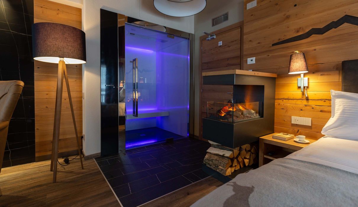 Custom-made furnishings for luxury mountain hotels: suites with in-suite saunas